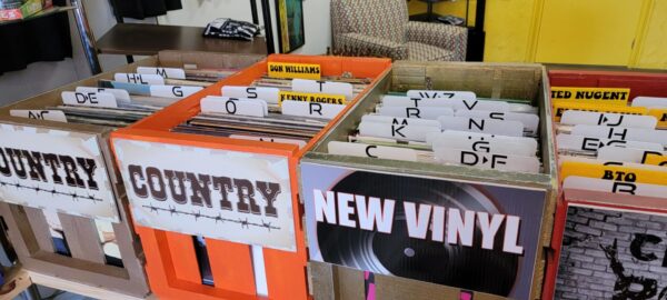 A box of records and vinyl are on display.