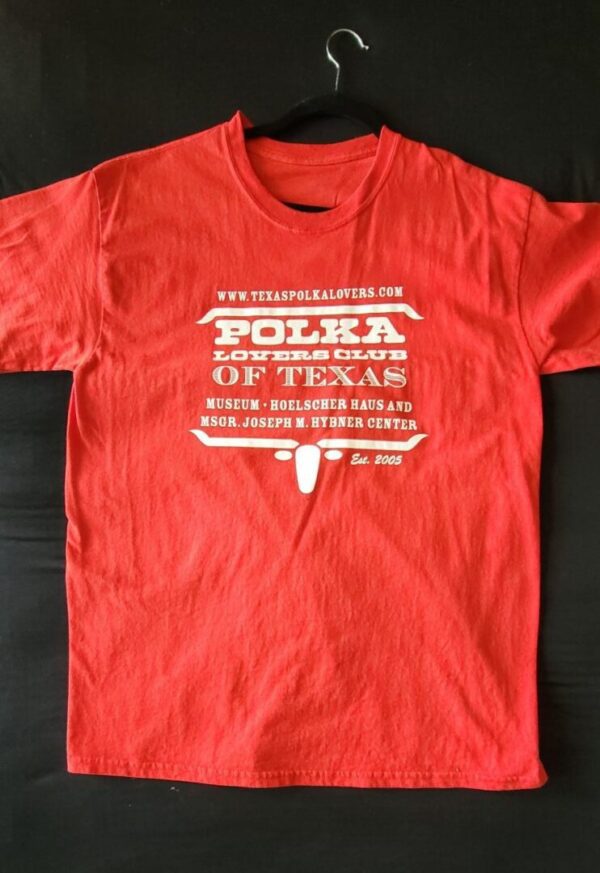 A red t-shirt with the words " polka, iowa state of texas ".