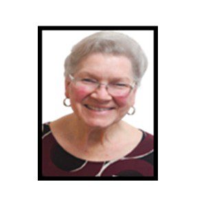 Smiling senior woman wearing glasses.