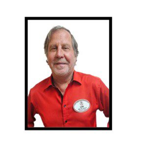 Here's an alt tag for the image: Smiling man in red shirt.