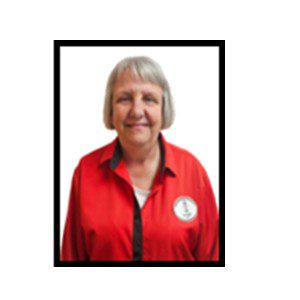 Smiling woman in red polo shirt.