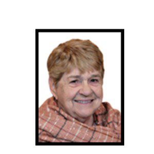 Smiling senior woman wearing a scarf.