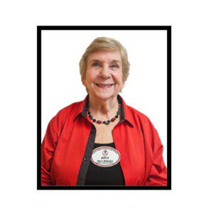 Smiling senior woman wearing a scarf.