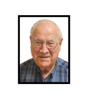 Smiling senior man in plaid shirt.